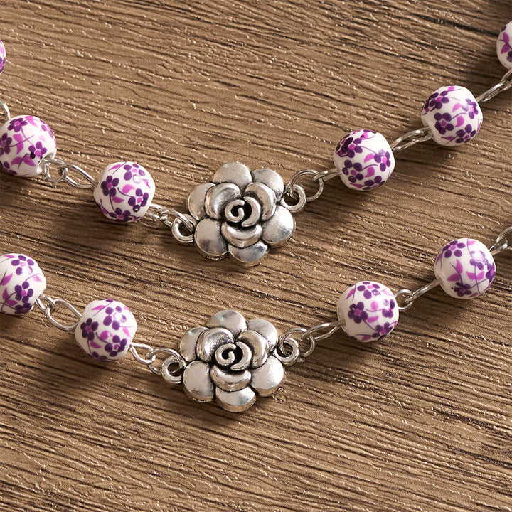 SolaceBeads Violet Blossom Ceramic Rosary: A Tapestry of Divine Grace