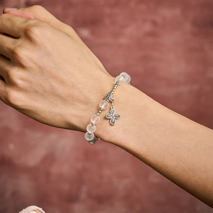 Solacebeads Frosted White Bead Bracelet: Sacred Clarity With Ornate Spacer &amp; Cross