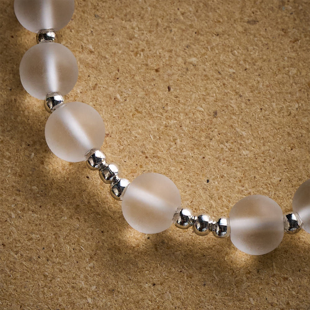 Solacebeads Frosted White Bead Bracelet: Sacred Clarity With Ornate Spacer &amp; Cross