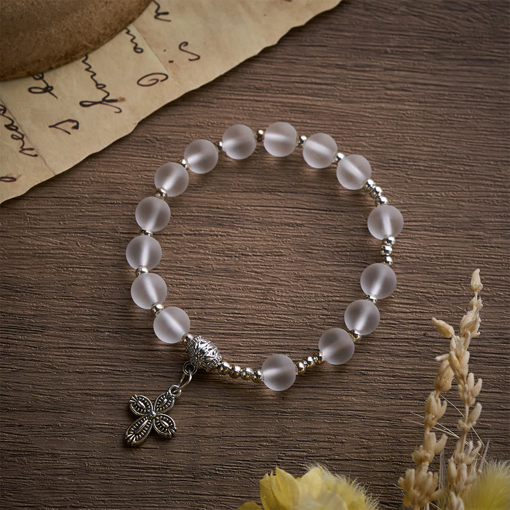 Solacebeads Frosted White Bead Bracelet: Sacred Clarity With Ornate Spacer &amp; Cross