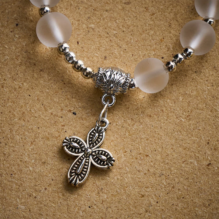 Solacebeads Frosted White Bead Bracelet: Sacred Clarity With Ornate Spacer &amp; Cross